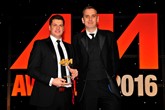 Lee Manning, digital marketing manager, Perrys Motor Sales (left), collects his award for Best Use of Television and/or Video from Jeremy Bennett, head of digital, AM 