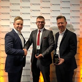 Lookers rising star Brad Baker (centre) celebrates his award with Matt Clay (right), Lookers group qualifications manager, and Steve Maule, group head of qualifications and diversity. 