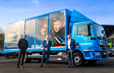 The Lookers leadership team with one of its fleet of delivery vans