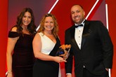 Louise Baker, head of fleet operations, Johnsons  Fleet Services, accepts the award from  Declan Gaule, chief executive, MFG Group, right, and host Lisa Snowdon, left