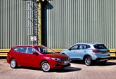 The new MG5 EV electric estate car (left) and the MG HS plug-in hybrid SUV