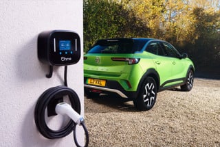 A Vauxhall Mokka EV plugged into an Ohme  charge point