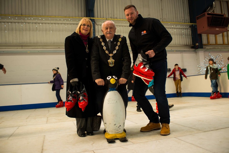 Peter Herrington, Mayor of Waltham Forest (centre) with Robert Jones, sales manager at Motorpoint Chingford