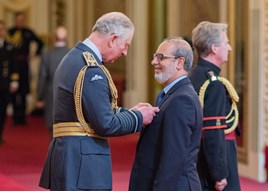 HRH The Prince of Wales presents Jennings Motor Group’s managing director, Nas Khan, with his OBE at Buckingham Palace. 