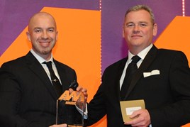 Nathan Tomlinson, managing director, Devonshire Motors, collects the award from  Christian Jamison, client service  director, Rhino Events, right