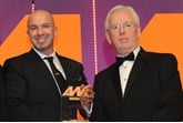 Nathan Tomlinson, managing director, Devonshire Motors, collects the award from  Richard Lailey, director, Autoguard Warranties, right