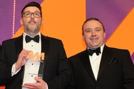 Neil Hodgson, general manager,  Perrys Worksop, collects the  award from Jimi Matthews, director of business development, Perfect Placement Automotive Recruitment, right