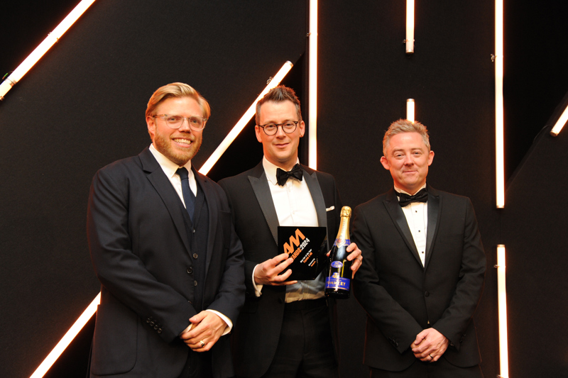 Stuart Sanders of Toyota (centre) collects the New Car of the Year Award