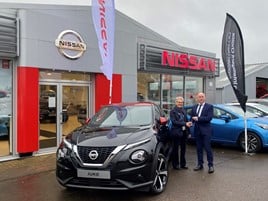 Patricia McIntosh collects her 27th new Nissan, a new Juke, from Crayford & Holt director Kevin Abbs