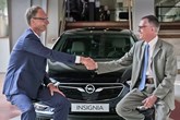 Opel chief executive Michael Lohscheller and PSA Group chief executive, Carlos Tavares (right)