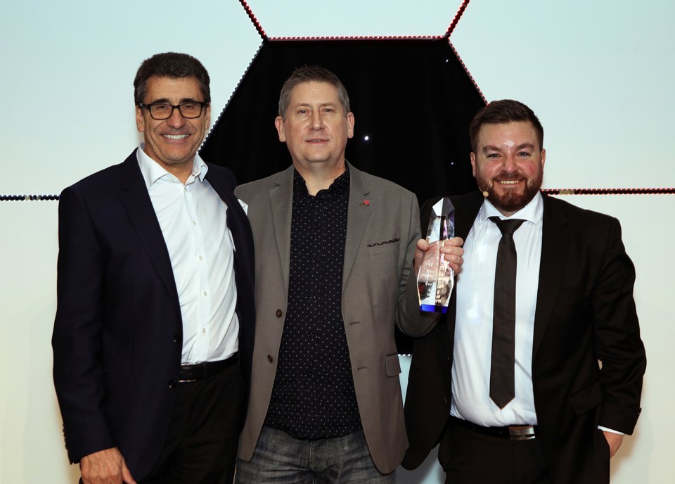 Andy Stevenson with Service Manager of the Year Paul Dittrich and Alex Brooker