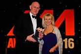 Philip Crossman, managing director, Honda UK (left), collects the award for New Car of the Year from Sue Healey, key account manager, Supagard