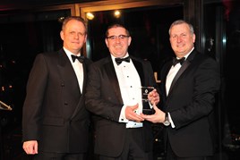 Paul Ward, director of Shelbourne Motors (centre) collects the award from Darren Payne, Sales Director at Renault UK, and Ken Ramirez, Managing Director of Renault UK