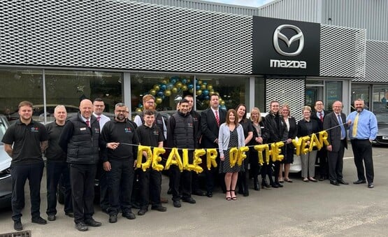 Staff at Beechwood Motor Group's Mazda UK car dealership in Derby celebrate their retailer of the year win