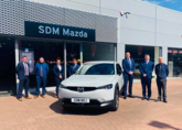 SDM Mazda's (from left) Steven Learmonth, Lewis Wood, Helen Aitken, Niall Syme and John Mallis with Mazda UK Head of Network Strategy Brett Hague and sales director Peter Allibon