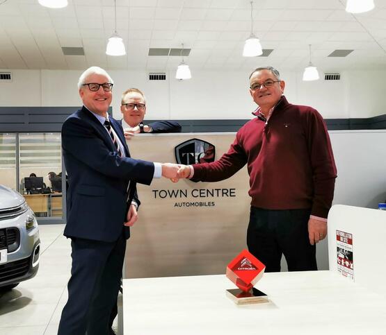 Done deal (from left): Sherwoods Motor Group chairman Chris Elvidge with MD Simon MacConachie and former Town Centre Automobiles owner Steve Smith