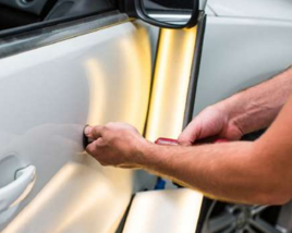 SMART repair being carried out on a car door