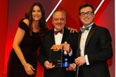 Stuart Foulds, chairman and chief executive,  TrustFord, accepts the award from Phill Jones,  managing director, Motors.co.uk, right, and host Lisa Snowdon left 