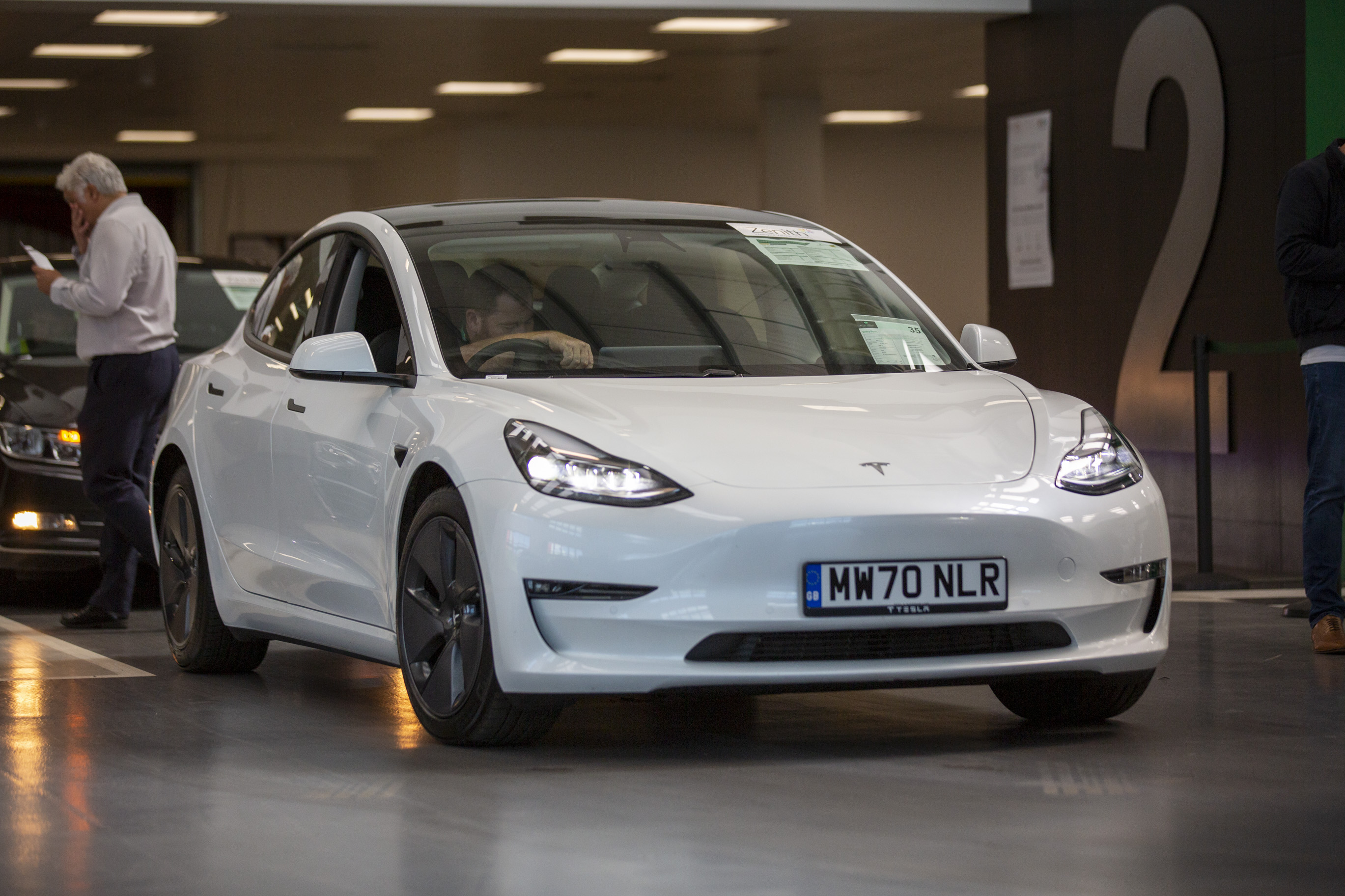 tesla model 3 going through an aston barclay auction