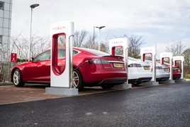 Tesla cars at supercharger EV charge point location