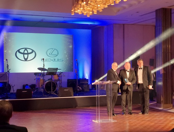 Darren Morris, chief financial officer at Toyota, collects the NFDA's Manufacturer Partner of the Year award