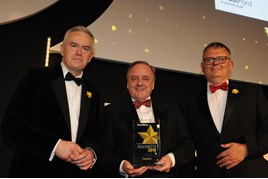 TrustFord chairman and chief executive, Stuart Foulds (centre), receives the Fleet News Fleet Dealer of the Year award