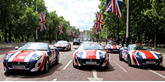 Jaguar cars in Union Jack colours on the Mall