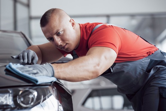 man polishing car