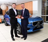UK Car of the Year director John Challen presents Jon Wakefield, managing director at Volvo Car UK, with the XC60's award