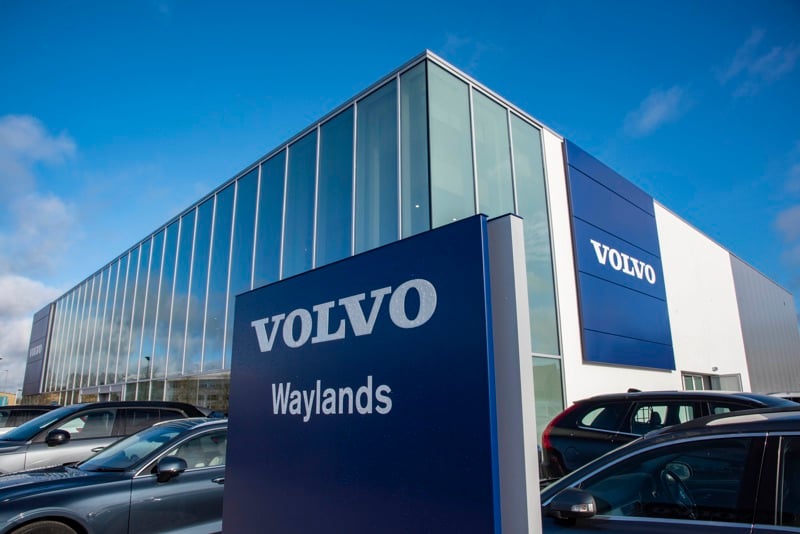 The sign for Waylands Volvo dealership at Reading with the showroom in the background